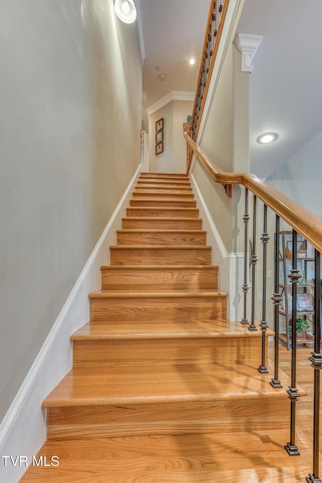 staircase featuring recessed lighting and crown molding