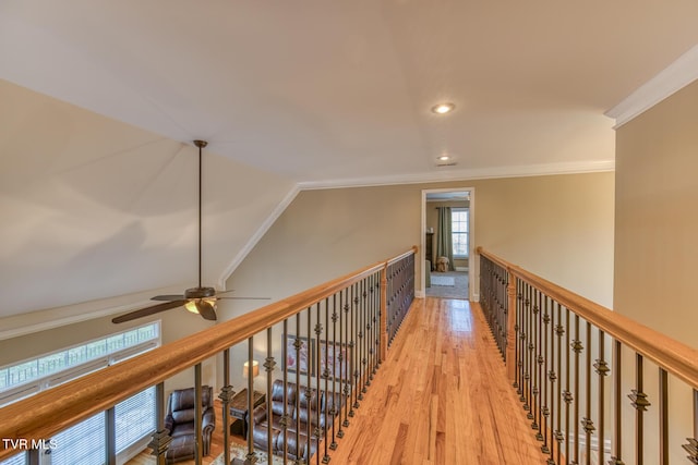 hall featuring ornamental molding, lofted ceiling, light wood-style floors, and recessed lighting