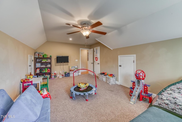 rec room with carpet, vaulted ceiling, and ceiling fan