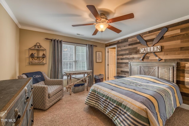 bedroom featuring crown molding, wood walls, visible vents, and light colored carpet