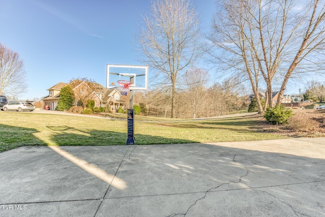 view of basketball court featuring a yard and community basketball court