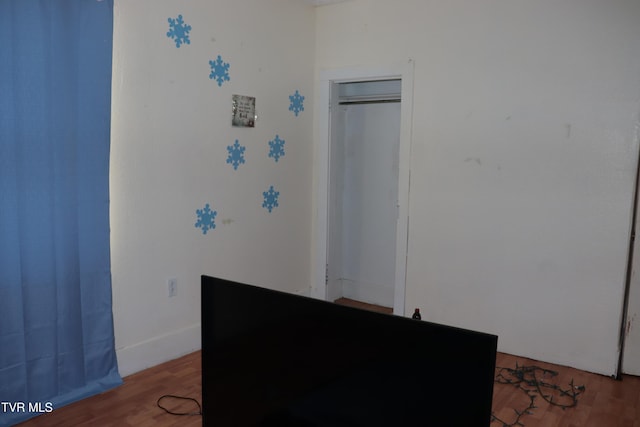 interior space featuring hardwood / wood-style flooring and a closet