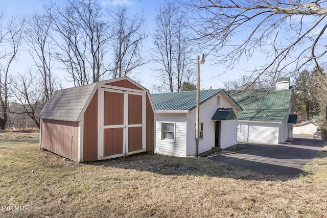 view of outdoor structure with a lawn