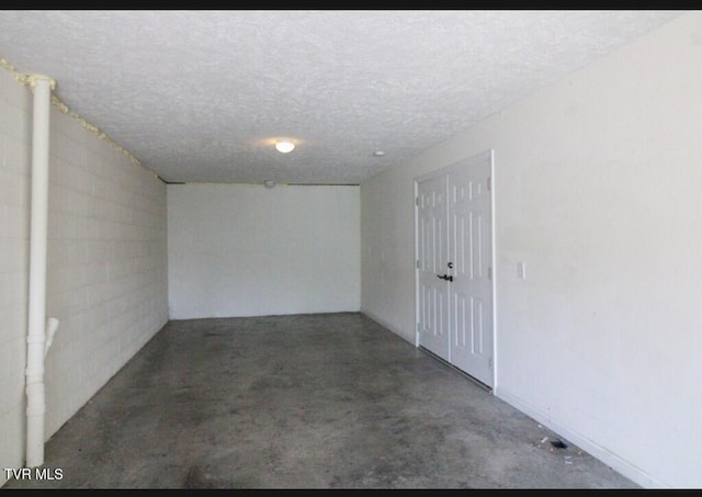 interior space featuring a textured ceiling