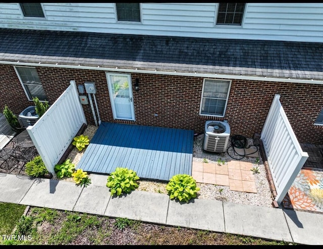 view of exterior entry with central AC