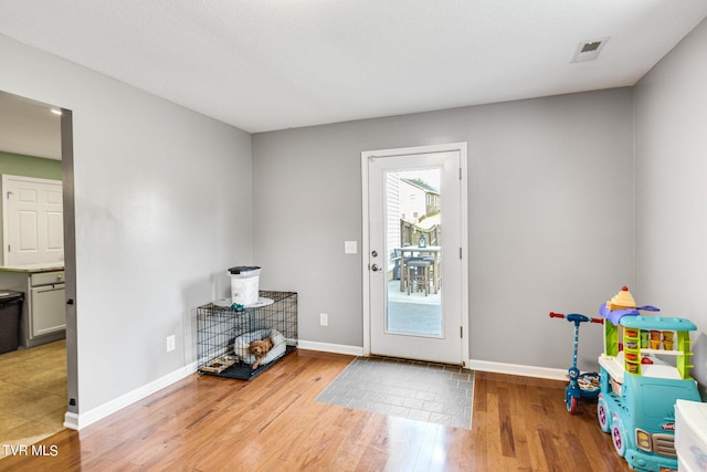 doorway with light hardwood / wood-style floors
