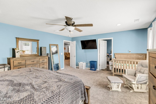 carpeted bedroom with ceiling fan