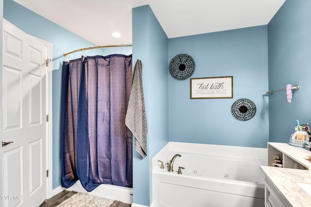 bathroom featuring separate shower and tub and vanity