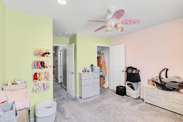 carpeted bedroom featuring ceiling fan