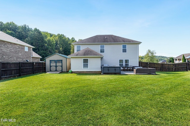 back of house with a patio, a yard, a hot tub, an outdoor living space, and a shed