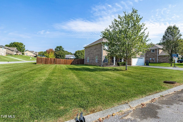 view of front facade featuring a front lawn and a garage