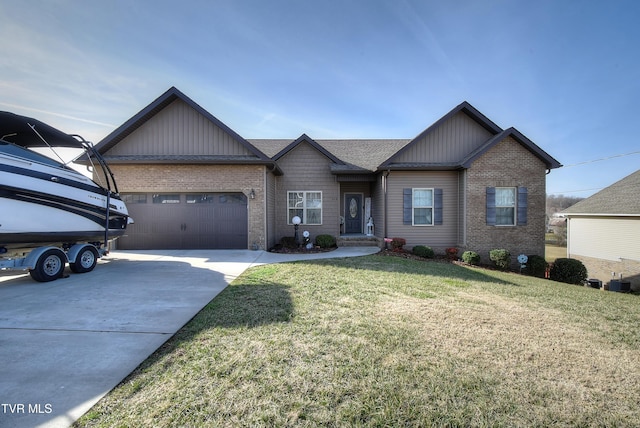 view of front of home featuring a front lawn and a garage