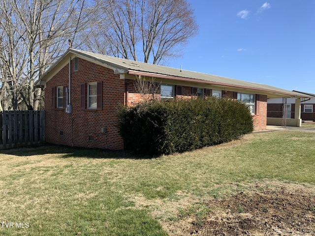 view of property exterior featuring a lawn