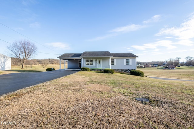 single story home with a carport, a front lawn, and aphalt driveway