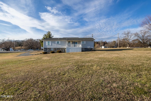 single story home with a porch and a front yard