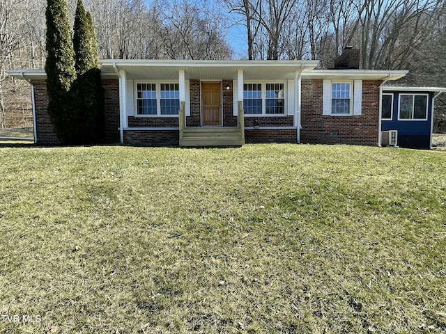 single story home featuring crawl space, a chimney, a front lawn, and brick siding