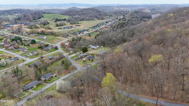 drone / aerial view featuring a forest view