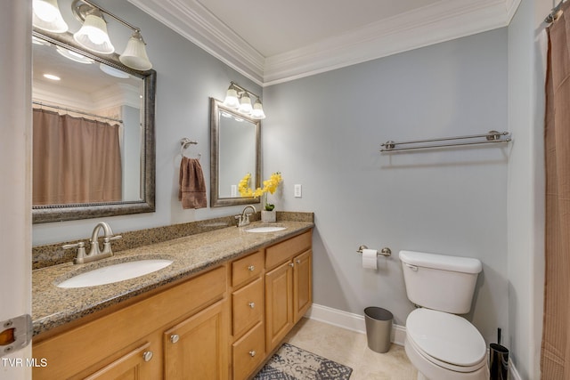 full bath featuring crown molding, a sink, toilet, and double vanity