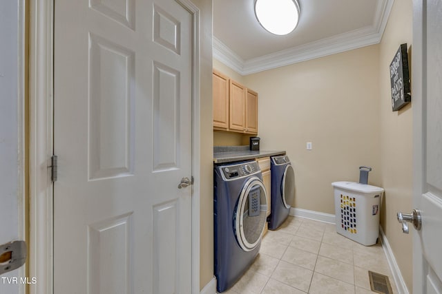 clothes washing area featuring light tile patterned flooring, visible vents, baseboards, ornamental molding, and washing machine and clothes dryer