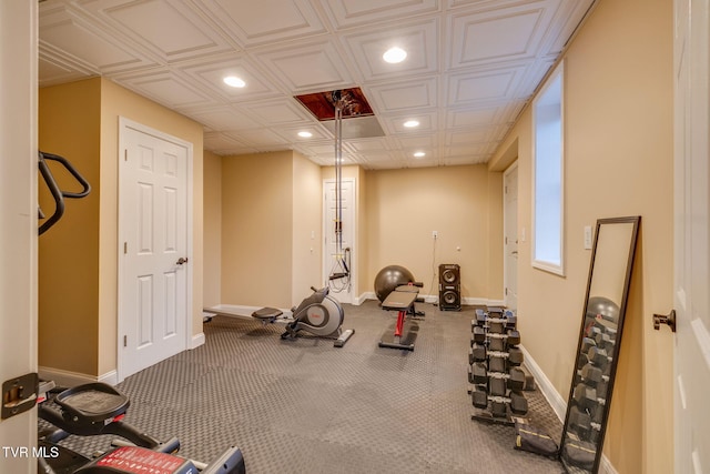 workout room featuring baseboards and recessed lighting