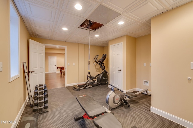 workout area with baseboards and recessed lighting