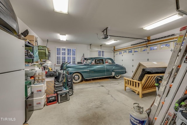 garage featuring a garage door opener