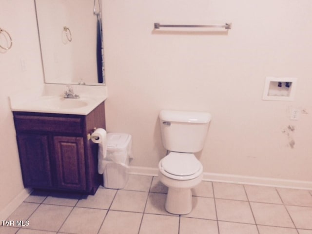 bathroom featuring vanity, toilet, and tile patterned floors