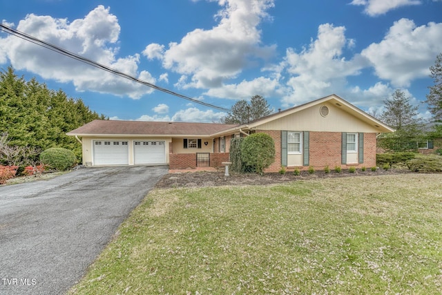 single story home with brick siding, a front lawn, aphalt driveway, and a garage