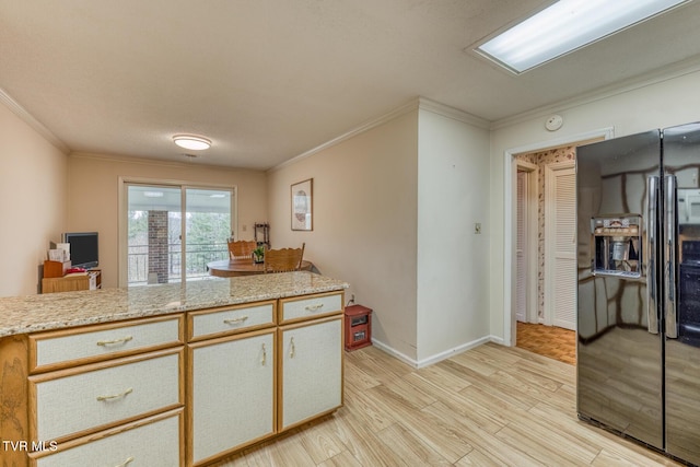 305 Overbrook Dr, Bristol, TN 37620 - kitchen with light wood finished floors, baseboards, crown molding, and black fridge with ice dispenser