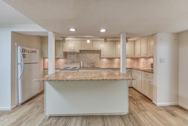 305 Overbrook Dr, Bristol, TN 37620 - kitchen featuring light wood-style flooring, a kitchen island, under cabinet range hood, and white appliances
