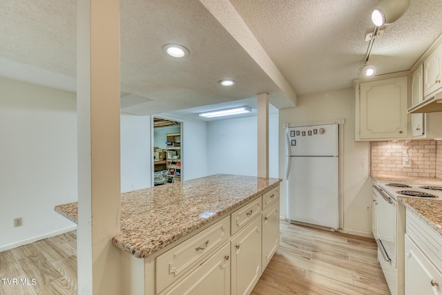 305 Overbrook Dr, Bristol, TN 37620 - kitchen with light stone counters, light wood finished floors, decorative backsplash, and white appliances