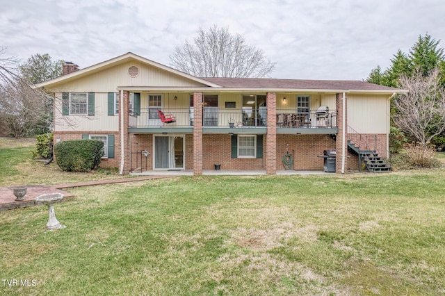305 Overbrook Dr, Bristol, TN 37620 - view of front facade featuring brick siding, a patio, a front lawn, and stairway