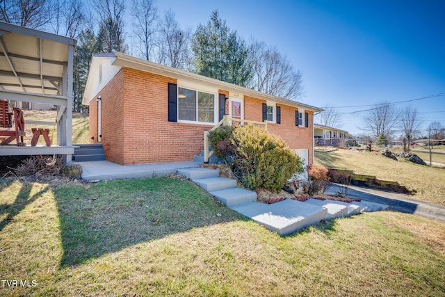 view of front of home featuring an attached garage, a front lawn, and brick siding