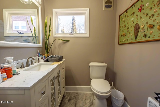 bathroom with visible vents, baseboards, toilet, marble finish floor, and vanity