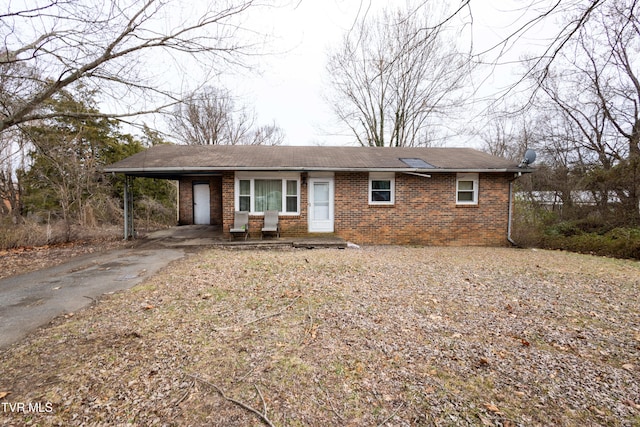 ranch-style home with a carport