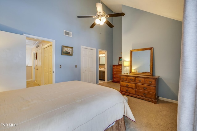 bedroom featuring light colored carpet, visible vents, ensuite bathroom, attic access, and baseboards