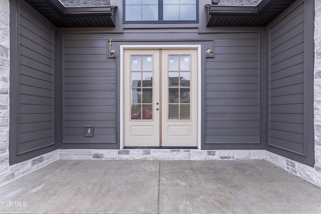 entrance to property with french doors and a patio