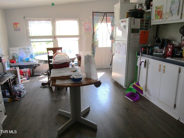 dining space featuring hardwood / wood-style flooring