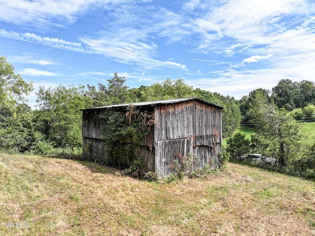 view of outdoor structure with a lawn