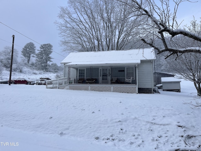 view of front of home with a sunroom