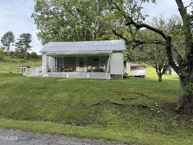 bungalow-style house featuring a porch and a front lawn