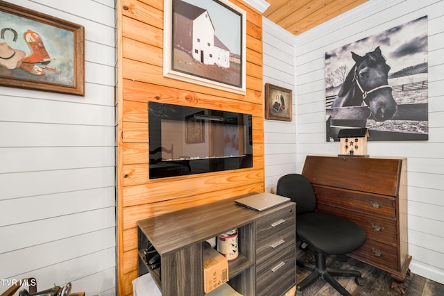 office area featuring wood walls