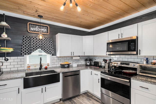 kitchen with stainless steel appliances, wood ceiling, and white cabinetry