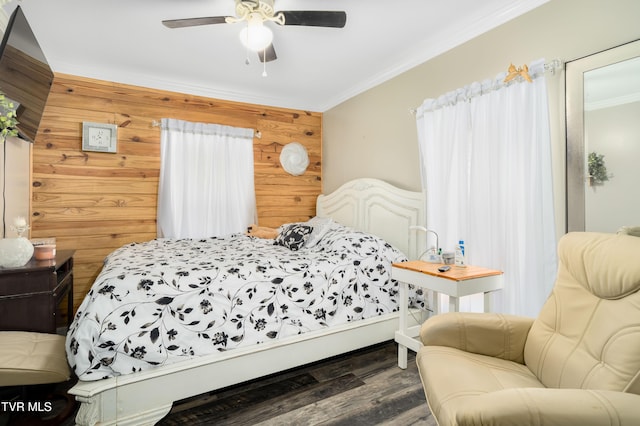 bedroom featuring ceiling fan, ornamental molding, dark wood finished floors, and wooden walls