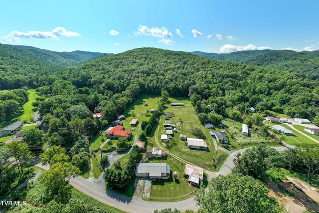 bird's eye view featuring a wooded view