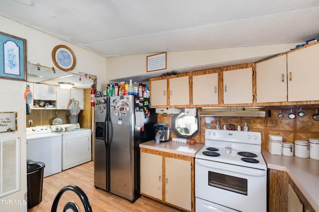 kitchen with washing machine and clothes dryer, white cabinetry, white range with electric cooktop, and stainless steel fridge with ice dispenser