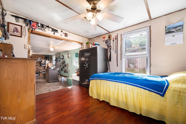 bedroom featuring ceiling fan and dark wood-style floors