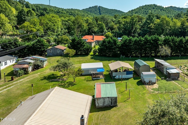 drone / aerial view with a forest view and a mountain view