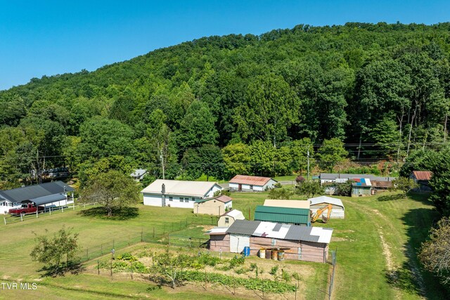 birds eye view of property with a forest view