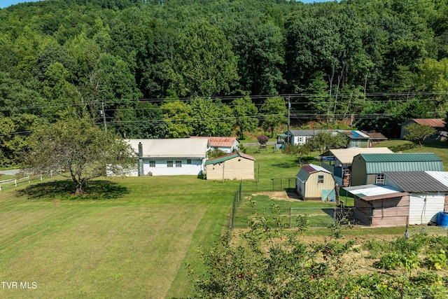 drone / aerial view with a view of trees